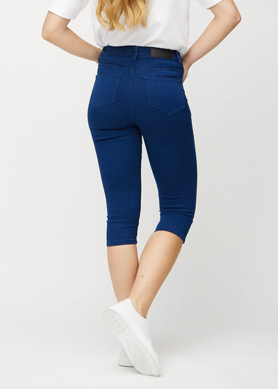 Mørkeblå skinny capris set bagfra, så man kan se hele produktet.